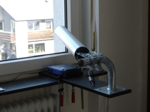A Linksys WRT54G with OpenWRT firmware and a decent antenna